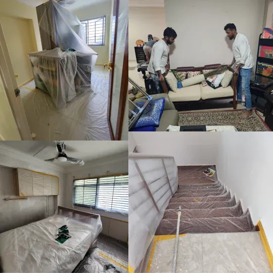 Two Eco Painting Service painters lifting a sofa clear of the wall before repainting